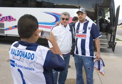Paul Fraughton  |  The Salt Lake Tribune 
Monterrey of Mexico fan Kenneth Maldonado takes a photo of fellow fan  Jose Sandoval, with his arm around Monterrey coach Victor Manuel Vucetich, left, on  Monday,  April 25, 2011. On Wednesday at Rio Tinto Stadium, Monterrey will try to halt RSL's bid to become the first-ever team from Major League Soccer to win the CONCACAF Champions League.