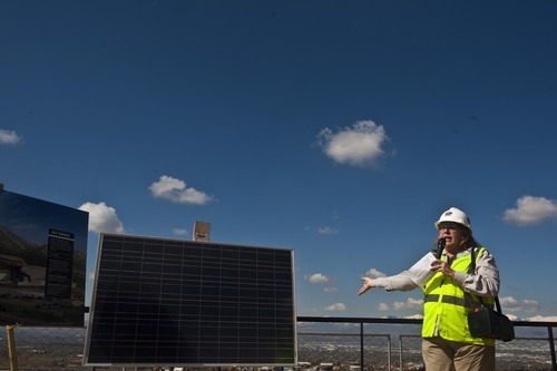 Chris Detrick | The Salt Lake Tribune 
Becky Menlove, director of exhibits and public programs for the Utah Museum of Natural History, shows a solar panel at the museum's new home, the Rio Tinto Center, on Wednesday. The museum will open in the fall.