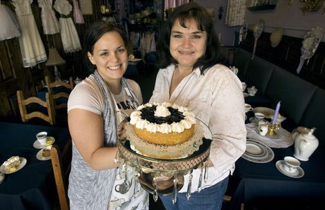 Steve Griffin  |  The Salt Lake Tribune
 
Baker Joell Hamer and owner Kathy Cushman hold a blueberry white chocolate cake at the Vintage Restaurant and Tea Room in Ogden on Monday, April 11, 2011.