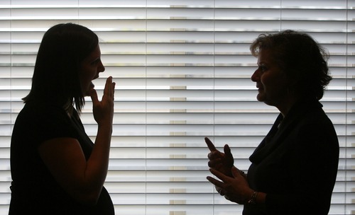 Steve Griffin  |  The Salt Lake Tribune
Joene Nicolaisen, executive director of the Sego Lily Center, talks in sign language with Mindy Colby, who is the center's interpreter, from their offices in Salt Lake City on Thursday, April 21, 2011.