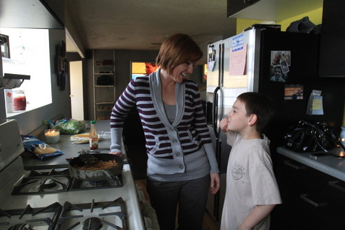 Rick Egan   |  The Salt Lake Tribune

Angie Watson chats with her 9-year-old son Noah,  as she prepares dinner, Monday, April 25, 2011. On Dec. 5, 2010 Watson found her 13-year-old son (Connor) dead from a prescription drug overdose. He had taken oxycodone from a friend's house, whose grandmother had left it and other medications sitting out on a kitchen counter.