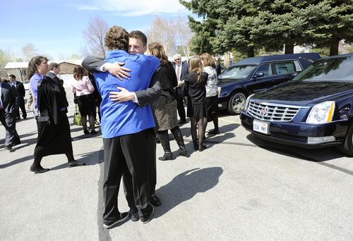 Sarah A. Miller  |  The Salt Lake Tribune

Jerry Dearden, 18 hugs friend Ross Terrill, 18, after the funeral for his father Hugh Dearden Monday April 11, 2011 at The Church of Jesus Christ of Latter-day Saints in Cottonwood Heights.
