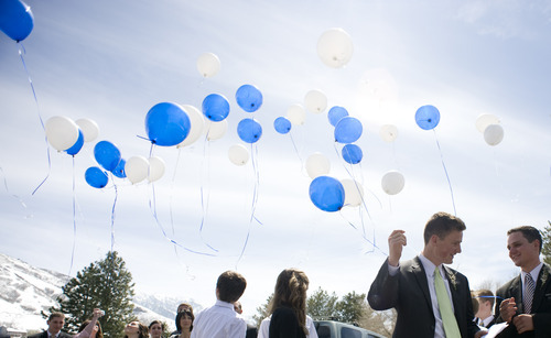 Sarah A. Miller  |  The Salt Lake Tribune

Jerry and his brother Daren Dearden talk as they release balloons from Sparta United, Jerry's club soccer team, outside of The Church of Jesus Christ of Latter-day Saints just after the funeral service for their father Hugh, Monday April 11, 2011 in Cottonwood Heights.