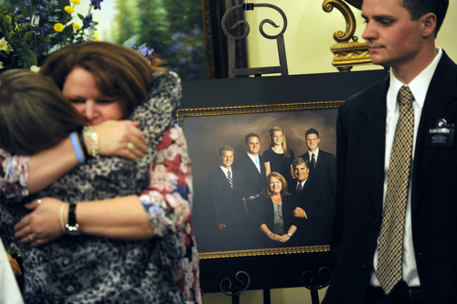 Sarah A. Miller  |  The Salt Lake Tribune

Diane Dearden and her son Daren Dearden, right, stand in front of a family portrait taken just before Daren left on his LDS mission to Mexico City at the visitation for Hugh Dearden Sunday April 10, 2011 in Sandy.