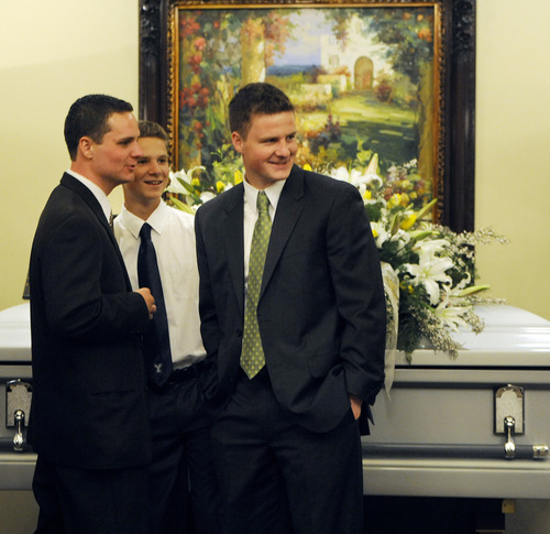 Sarah A. Miller  |  The Salt Lake Tribune

Brothers Daren, 20, Conner, 13, and Jerry Dearden, 18, share a brief second together at the visitation for their father Hugh Dearden Sunday, April 10, 2011 at Larkin Mortuary in Sandy. Hundreds of friends and family attended the visitation.