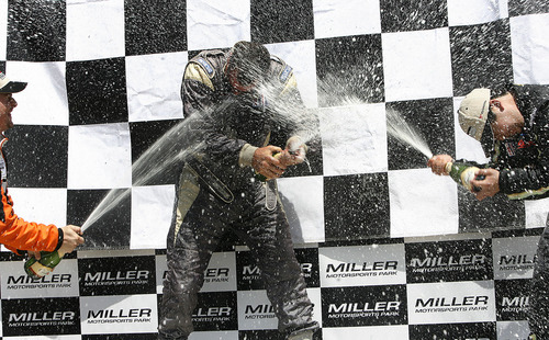 Scott Sommerdorf  |  The Salt Lake Tribune
GT3P - Platinum Class - winners Henrique Cisneros (3rd place, left), and Brian Wong (2nd place, right) spray Tim McKenzie, the winner of the event with champagne on the winners podium for the GT3P event of the IMSA GT3 Cup Challenge held at Miller Motorsports Park, Sunday, May 1, 2011.