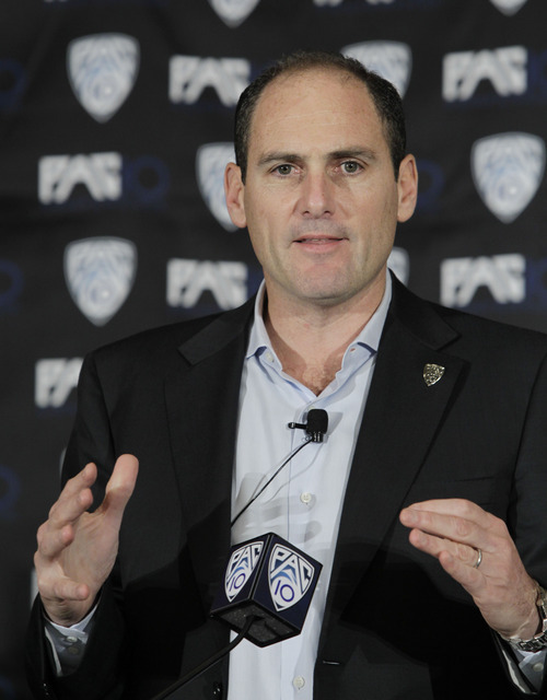 FILE - This Oct. 21, 2010, file photo shows Pac-10 commissioner Larry Scott announcing the splitting of NCAA college football divisions during a news conference in San Francisco. The Pac-10 agreed to a 12-year television contract with Fox and ESPN on Tuesday, May 3, 2011,  that will more than triple its media rights fees and be the most valuable for any conference in college sports.(AP Photo/Paul Sakuma, File)