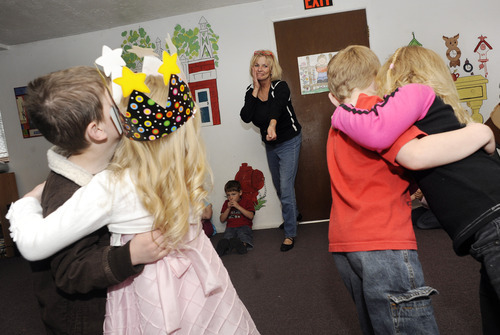 Sarah A. Miller  |  The Salt Lake Tribune

Preschool teacher Sandra Ahlquist of Aunt Sands' Preschool encourages her students to dance and sing as they work on songs during class for an upcoming musical program. Aunt Sands' received the Essential Piece award from West Valley City for its work in the community for 31 years.