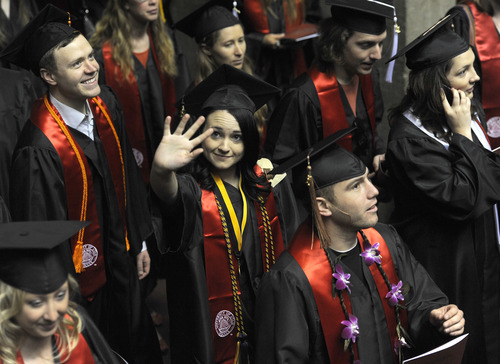 Sarah A. Miller  |  The Salt Lake Tribune

Modern dance student Mallory Rosenthal of Salt Lake City walks in the processional and waves to her family during the University of Utah commencement at the Huntsman Center Friday May 6, 2011, in Salt Lake City. Over 7,000 students received their degrees.