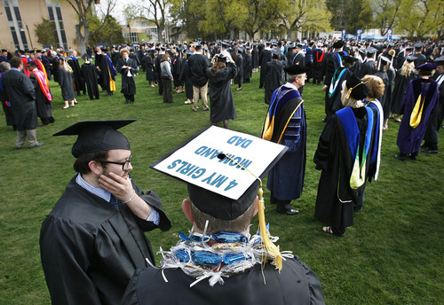 Scott Sommerdorf  |  The Salt Lake Tribune
Brent Ewell adorned his mortarboard with a message for loved ones as he waiting in the quad for the procession to The Spectrum for Utah State's Graduation in Logan, Saturday, May 7, 2011. Ewell earned his degree in Science.