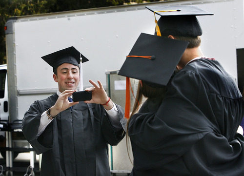 Scott Sommerdorf  |  The Salt Lake Tribune
Ben Wood made a photo for fellow graduates prior to Utah State Graduation in Logan, Saturday, May 7, 2011. Wood would later be given his degree in Humanities and Social Sciences.