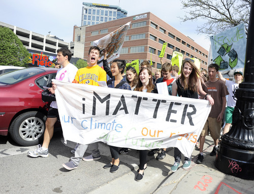 SARAH A. MILLER  |  Tribune File Photo
A group of teens and environmental activists have been rebuffed by eight state agencies in their attempt to get regulation of greenhouse gases adopted in state rules. The Air Quality Board rejected the group's petition on Wednesday. In this file photo from May, iMatter participants march in downtown Salt Lake City to demand concrete actions against climate change.