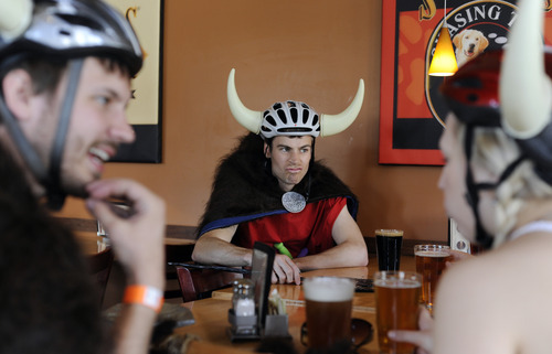 Sarah A. Miller  |  The Salt Lake Tribune

Nick Rothacher makes a face at his friends as they take in some drinks at Squatters Pub Brewery during the second annual Tour de Brewtah March Saturday May 7, 2011 in Salt Lake City. They called their viking-themed group the Bikings. Four hundred bicyclists participated in the event to raise funds for Splore, Utah Clean Energy and Cottonwood Canyons Foundation. Bicyclists were given tickets to try different local beers at several area bars. They were encouraged to register as a team and dress in costume.