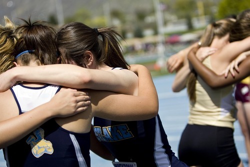 Djamila Grossman  |  The Salt Lake Tribune

High school girls huddle in a prayer before their race at the BYU Track and Field Invitational at Brigham Young University in Provo, Utah, on Saturday, May 7, 2011.