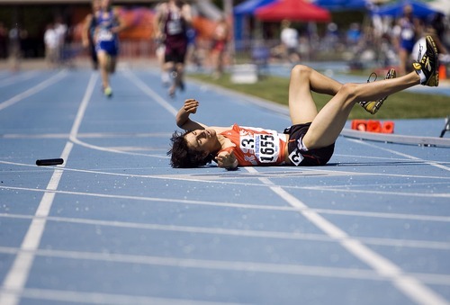 Djamila Grossman  |  The Salt Lake Tribune

Ricky Faure of Rock Springs High School falls after his relay race at the BYU Track and Field Invitational at Brigham Young University in Provo, Utah, on Saturday, May 7, 2011.