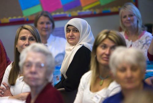 Al Hartmann  |  The Salt Lake Tribune
Several women from the Muslim community, including Zahra Noori, center, brought lunch to the Wasatch Presbyterian Church women's group and ate together on Thursday.  It was a than-you to the church board, which bought dozens of copies of the Quran to be distributed, free of charge, to anyone interested in reading Islam's holy book.