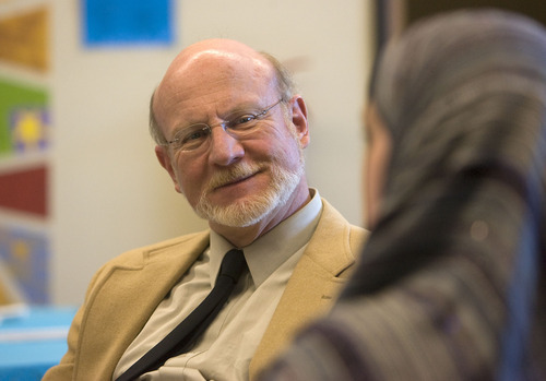 Al Hartmann  |  The Salt Lake Tribune
Wasatch Presbyterian Church's Rev. Scott Dalgarno enjoys a conversation with Kirin Nabi on Thursday. Several women from the Muslim community brought a traditional lunch to the Wasatch Presbyterian Church women's group and ate together on Thursday.  It was a thank you to the church board, which bought dozens of copies of the Quran to be distributed, free of charge, to anyone interested in reading Islam's holy book.