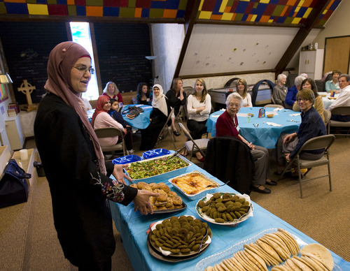 Al Hartmann  |  The Salt Lake Tribune
Maysa Kergaye, left, describes the some of the traditional food to be served at the Wasatch Presyberian Church on Thursday brought by several women from the Muslim community  It was a thank you to the church board, which bought dozens of copies of the Quran to be distributed, free of charge, to anyone interested in reading Islam's holy book.