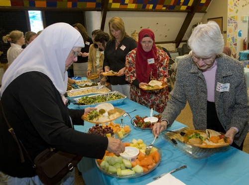Al Hartmann  |  The Salt Lake Tribune
Several women from the Muslim community brought a traditional lunch to the Wasatch Presbyterian Church women's group and ate together on Thursday. It was a thank-you to the church board, which bought dozens of copies of the Quran to be distributed, free of charge, to anyone interested in reading Islam's holy book.