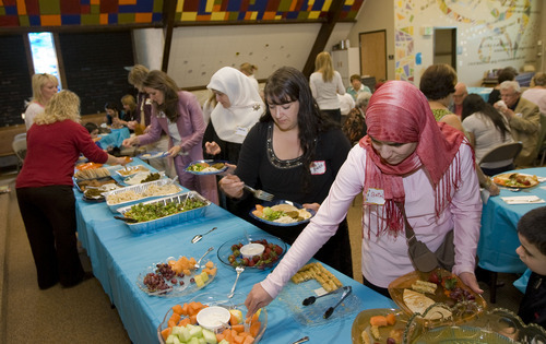 Al Hartmann  |  The Salt Lake Tribune
Several women from the Muslim community brought a traditional lunch to the Wasatch Presbyterian Church women's group and ate together on Thursday. It was a thank-you to the church board, which bought dozens of copies of the Quran to be distributed, free of charge, to anyone interested in reading Islam's holy book.