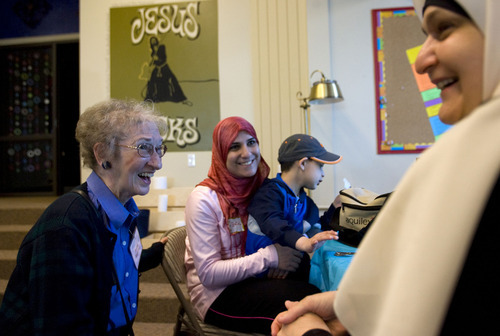 Al Hartmann  |  The Salt Lake Tribune
Anita Rigstad, of the Wasatch Presbyterian Church, left, gets to know Batol Alsallal and her son Twana, 4, along with Zahra Noori, right. Several women from the Muslim community brought lunch to the Wasatch Presbyterian Church women's group and ate together on Thursday.  It was a thank-you to the church board, which bought dozens of copies of the Quran to be distributed, free of charge, to anyone interested in reading Islam's holy book.