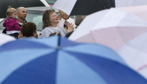 Steve Griffin  |  The Salt Lake Tribune

Debra Brown smiles and looks up to the sky after releasing yellow balloons minutes after being released from the Utah State Prison in Draper on Monday, May 9, 2011. Brown, 53, was convicted in 1995 of fatally shooting her friend and employer -- 75-year-old Lael Brown -- at his Logan home. But last week, 2nd District Judge Michael DiReda exonerated Debra Brown of the 1993 murder, saying she could not be the killer, based on hearings that included never-before-heard testimony.