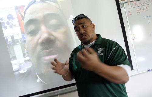 Francisco Kjolseth  |  The Salt Lake Tribune
Kearns High school teacher Pene Talamaivao, also known as Mr. T, talks about the creation of his alter ego, Mr. P, seen on the screen, whom he creates from time to time to help out in his classes of English, language arts and U.S. history. By using an iPod touch, he is able to film himself and then play it back during class as he interacts with himself to keep his students engaged.