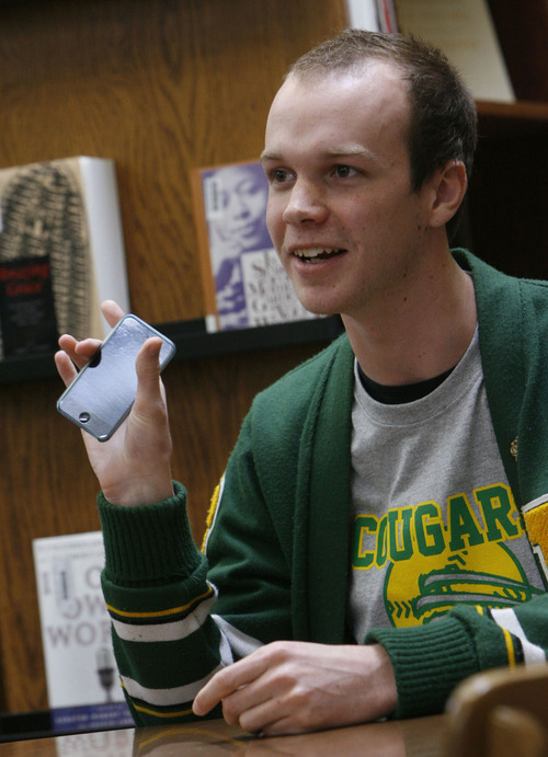 Francisco Kjolseth  |  The Salt Lake Tribune
Brandon Terry, senior class president at Kearns High School, expresses his support over the school's initiative to give every student an iPod touch to help in the learning process. For the past six months 1,700 students have been exploiting the potential for the electronic device. Seniors who graduate on time will get to keep the devices after the school year ends.