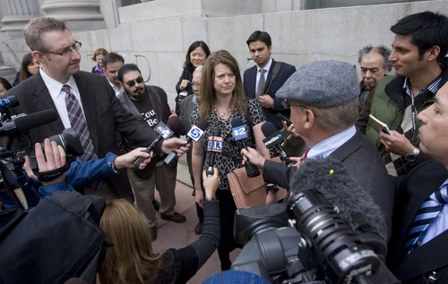 STEVE GRIFFIN  |  The Salt Lake Tribune
ACLU attorney Darcy Goddard talks with reporters outside the Frank Moss Federal Courthouse in Salt Lake City on Tuesday following a judge's ruling blocking Utah's immigration enforcement law from taking effect. The temporary restraining order lasts only until a July court hearing.