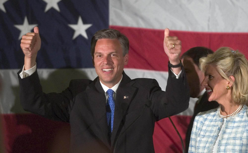 File Photo  |  The Salt Lake Tribune
Jon Huntsman Jr. celebrates his victory in the Republican primary for Utah governor in 2004. Wife Mary Kaye Huntsman is at right.