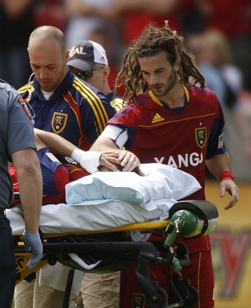 Trent Nelson  |  The Salt Lake Tribune
Real Salt Lake's Kyle Beckerman offers a hand of support to injured teammate Javier Morales on May 7.