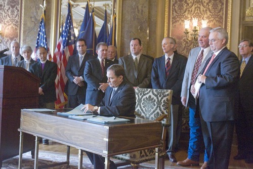 PAUL FRAUGHTON  |  The Salt Lake Tribune 
Utah Gov. Gary Herbert on Tuesday signed into law immigration  bills passed in this year's legislative session, including a controversial guest worker plan. The signing ceremony included leading lawmakers, LDS Presiding Bishop H. David Burton, far left, Sutherland Institute President Paul Mero, fourth from left, and Salt Lake Chamber of Commer President Lane Beattie, sixth from left.