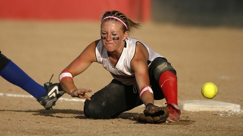 Trent Nelson  |  The Salt Lake Tribune
Grand County's Amanda Sheets fields a wild throw at third base as San Juan defeats Grand County High School 3-1 in 2A girls softball, in Spanish Fork, Utah, Friday, May 13, 2011.