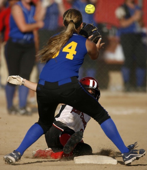 Trent Nelson  |  The Salt Lake Tribune
Grand County's Amanda Sheets slides into second base as San Juan's Brooke Lyman waits for the ball. San Juan defeats Grand County High School 3-1 in 2A girls softball, in Spanish Fork, Utah, Friday, May 13, 2011.