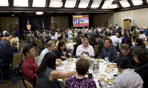 Al Hartmann  |  The Salt Lake Tribune
Attendees at the Utah Hispanic Chamber of Commerce 5th Annual Convention and Expo listen to keynote speakers during lunch Friday.