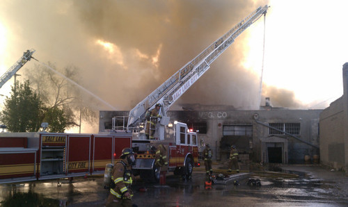 Salt Lake City ladder trucks shoot water into an old furniture building on 600 West near 200 South on Saturday, May 15, 2011. There were no occupants in the building and no inures reported. Photo by Nate Carlisle/The Salt Lake Tribune