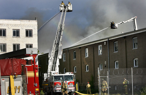 Scott Sommerdorf  |  The Salt Lake Tribune
Four alarm fire at an unoccupied building near 600 West between 200 and 300 South across from the Intermodal Hub, Saturday, May 14, 2011.