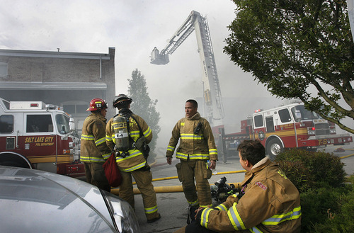 Scott Sommerdorf  |  The Salt Lake Tribune
Fire crews work in shifts - some rest while others fight the four alarm fire at an unoccupied building near 600 West between 200 and 300 South across from the Intermodal Hub, Saturday, May 14, 2011.