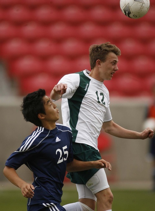 Trent Nelson  |  The Salt Lake Tribune
St. Joseph's Zee Kim heads the ball, ahead of Waterford's Gene Bay. Waterford defeats St. Joseph 2-1 in the 2A State Championship high school soccer game at Rio Tinto Stadium, in Sandy, Utah, Saturday, May 14, 2011.