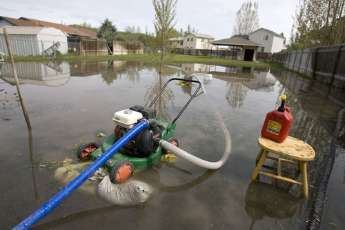 Al Hartmann  |  The Salt Lake Tribune
Sump pumps are running nonstop in the Country Manor Estate subdivision along the Blacksmith Fork River south of Logan.