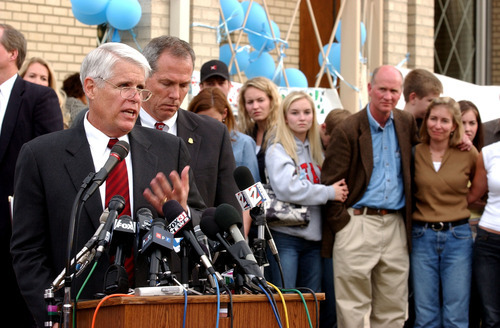Paul Fraughton  |  The Salt Lake Tribune

With members of the Smart family looking on, then-Salt Lake Police Chief Rick Dinse answers questions from the media concerning the investigation into the Elizabeth Smart case in March 2003.