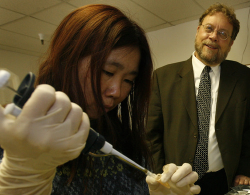 Jack Brittain, pictured with an Idaho Technology scientist in this 2005 Tribune file photo, is vice president for technology ventures and the architect of the U.'s tech-transfer system.
