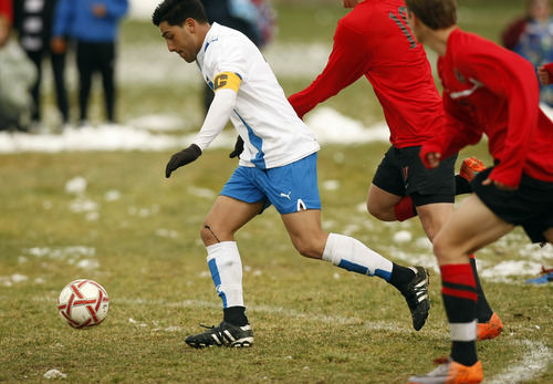 Chris Detrick | The Salt Lake Tribune 
Cyprus' Andy Rodriguez runs past West's Carlos Sanchez during the game at Cyprus High School on Friday.