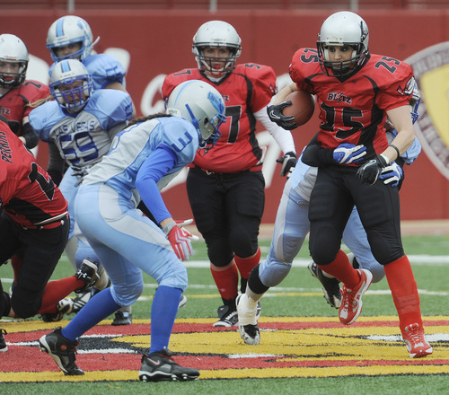 Sarah A. Miller  |  The Salt Lake Tribune

Utah Blitz player Annie Smith is tackled by Las Vegas opponents during their game at the Judge Memorial High School football field Saturday afternoon May 14, 2011. The all-female team played the Las Vegas Show Girlz.