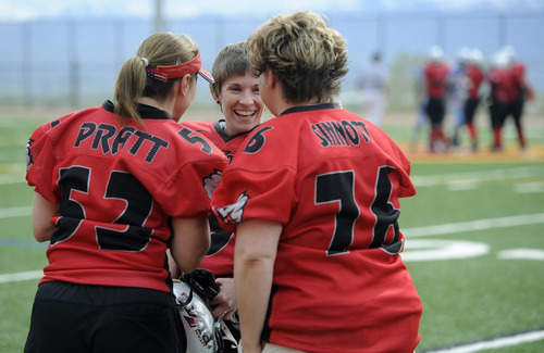 Sarah A. Miller  |  The Salt Lake Tribune

Utah Blitz players Jeanne Pratt, right, Alicia Tucker, center, and Carrissa Sinnott, right, talk before their game begins at the Judge Memorial High School football field Saturday afternoon May 14, 2011. The all-female team played the Las Vegas Show Girlz.