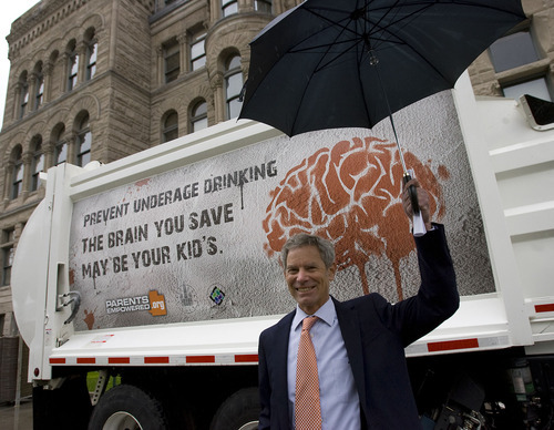 Al Hartmann  |  The Salt Lake Tribune
Salt Lake City Mayor Ralph Becker shows  the new underage drinking message that will appear on the sides of  Salt Lake City sanitation trucks. The announcement was made at the Salt Lake City County Building on Wednesday, May 18.