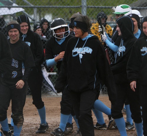 Steve Griffin  |  The Salt Lake Tribune

West Jordan players surround Markii Ashton after she belted a home run during game against Murray at the Salt Community College in Taylorsville, Utah Wednesday, May 18, 2011.