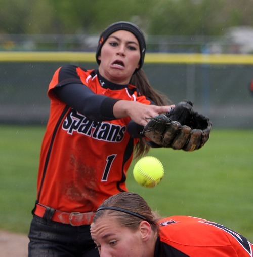 Steve Griffin  |  The Salt Lake Tribune

 Murray second baseman Lauren Bell can't catch a pop fly as first baseman Elise Johnson tries to get out of the way during game against West Jordan at the Salt Community College in Taylorsville, Utah Wednesday, May 18, 2011.