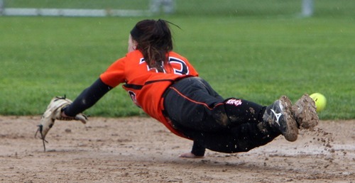 Steve Griffin  |  The Salt Lake Tribune

 Murray shortstop Sara Park dives for a line drive during game against West Jordan at the Salt Community College in Taylorsville, Utah Wednesday, May 18, 2011.