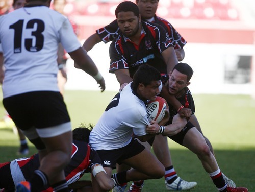 Djamila Grossman  |  The Salt Lake Tribune

Highland's Kobi Harris (10) gets tackled by several United players in the Rugby Championship game at Rio Tinto Stadium in Sandy, Utah, on Saturday, May 21, 2011. Highland won the game.